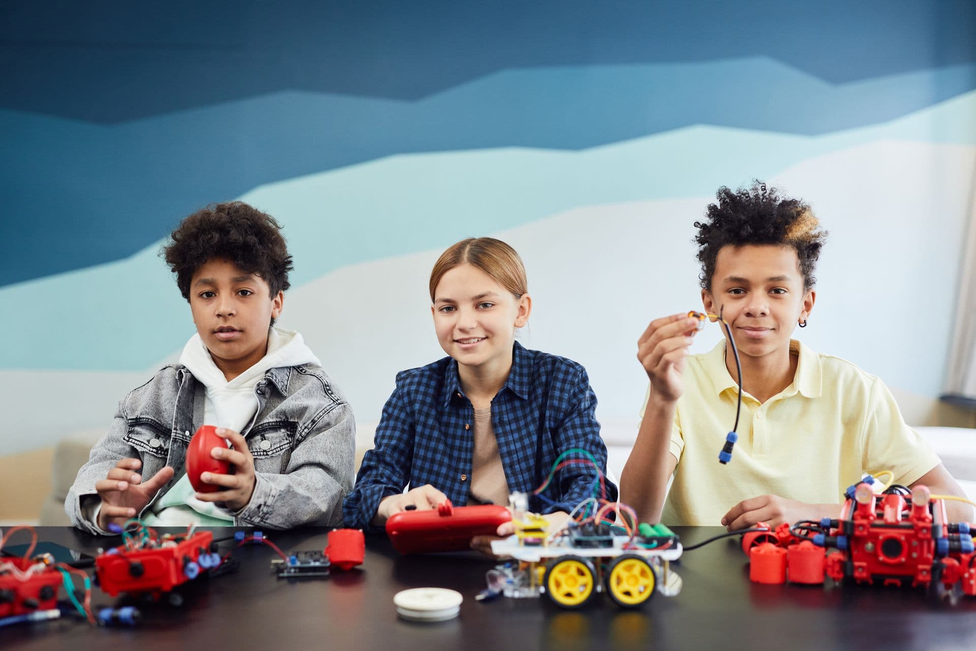 Students building a robot together